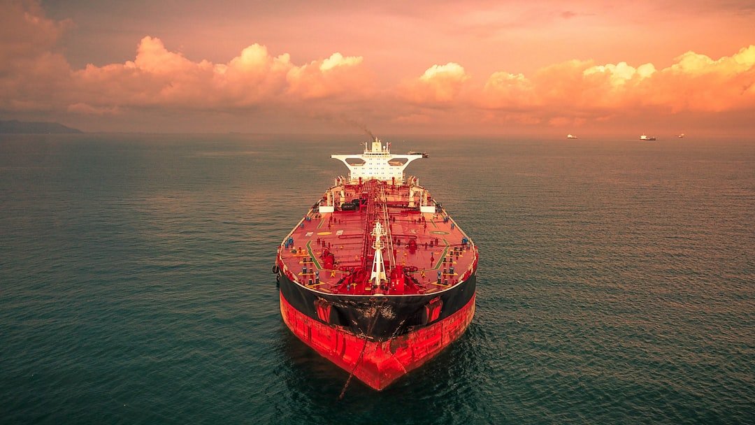 Oil tanker ship at sea representing crude oil supply risk in the Strait of Hormuz