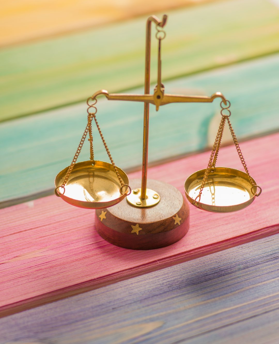 Gold balance scale representing leverage and margin in forex trading