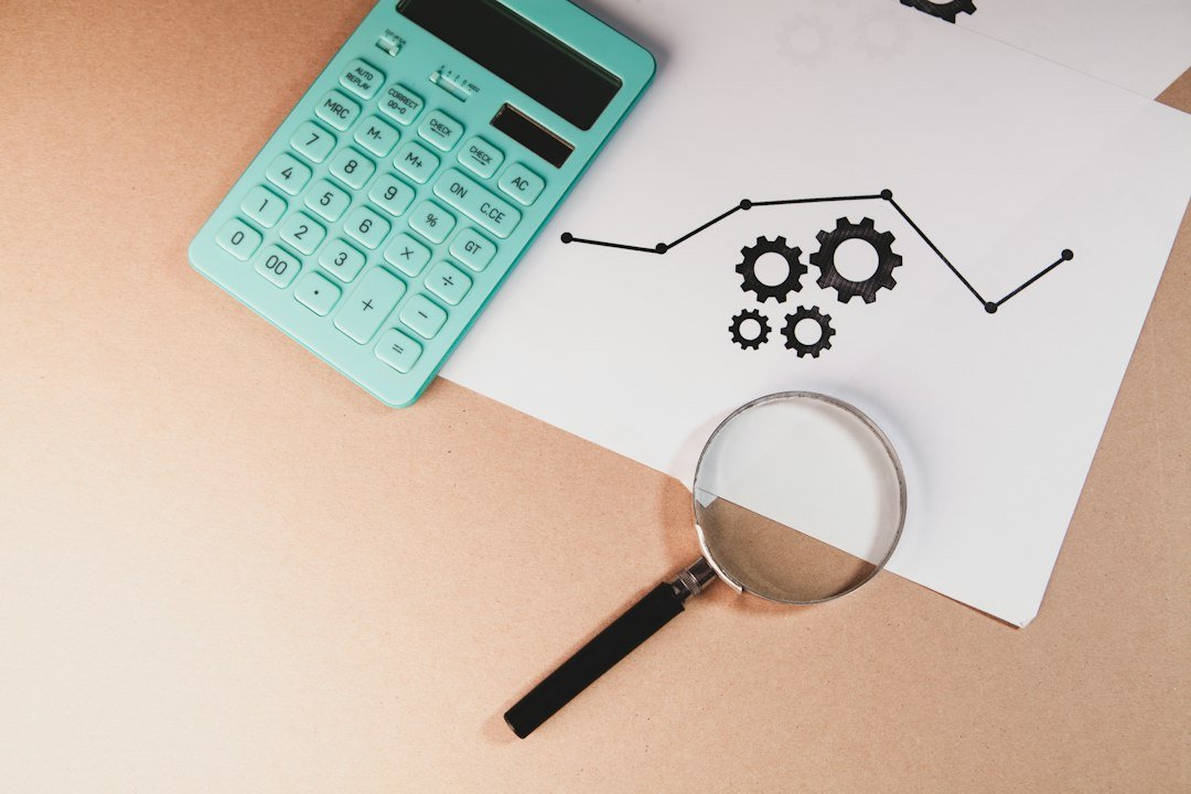 Magnifying glass over a financial chart representing understanding pips in forex trading