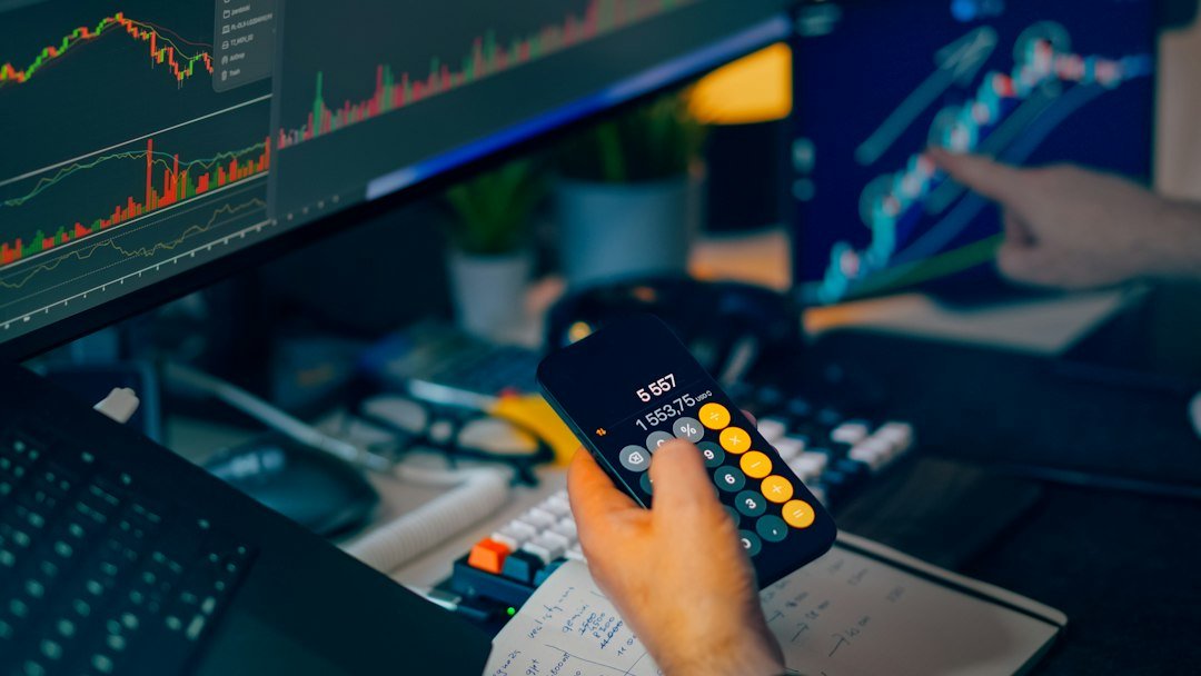 Trader analyzing charts across multiple monitors representing the daily forex market wrap
