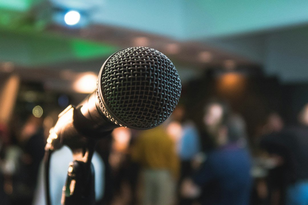 Microphone on a stand representing Federal Reserve officials speaking on future rate hikes