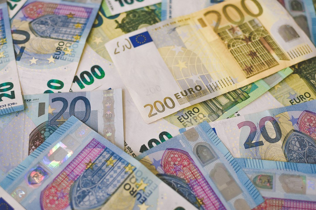 Pile of euro banknotes representing the euro falling to 17-month lows against the dollar