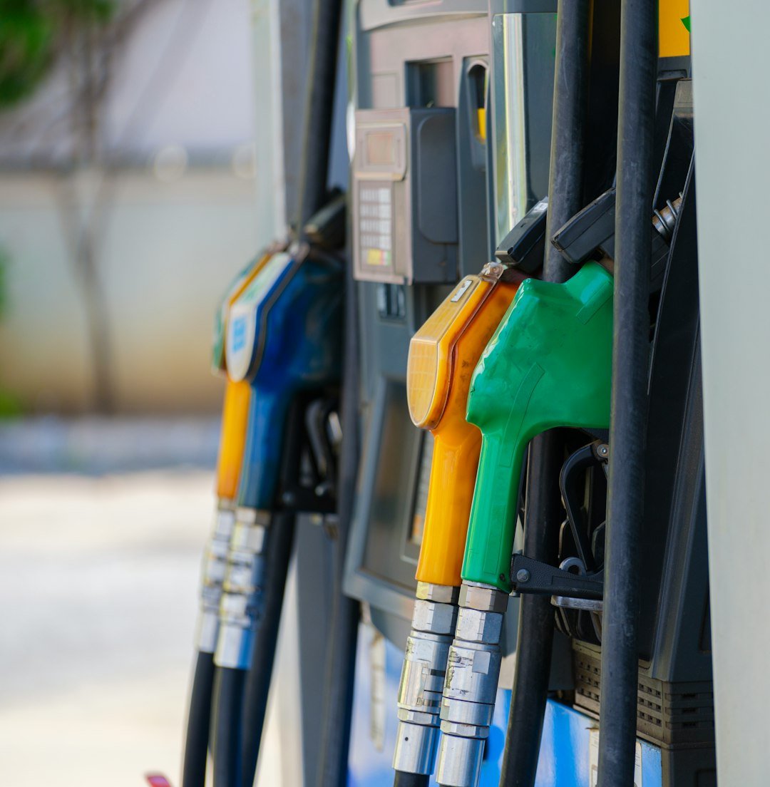 Row of gas pumps representing record fuel prices driving US inflation data